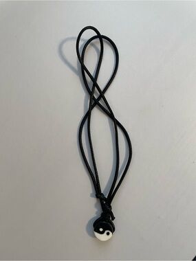 Cord necklace adjustable with yin and yang pendant